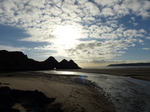 FZ010214 Three Cliffs Bay hole in rocks and river over beach.jpg